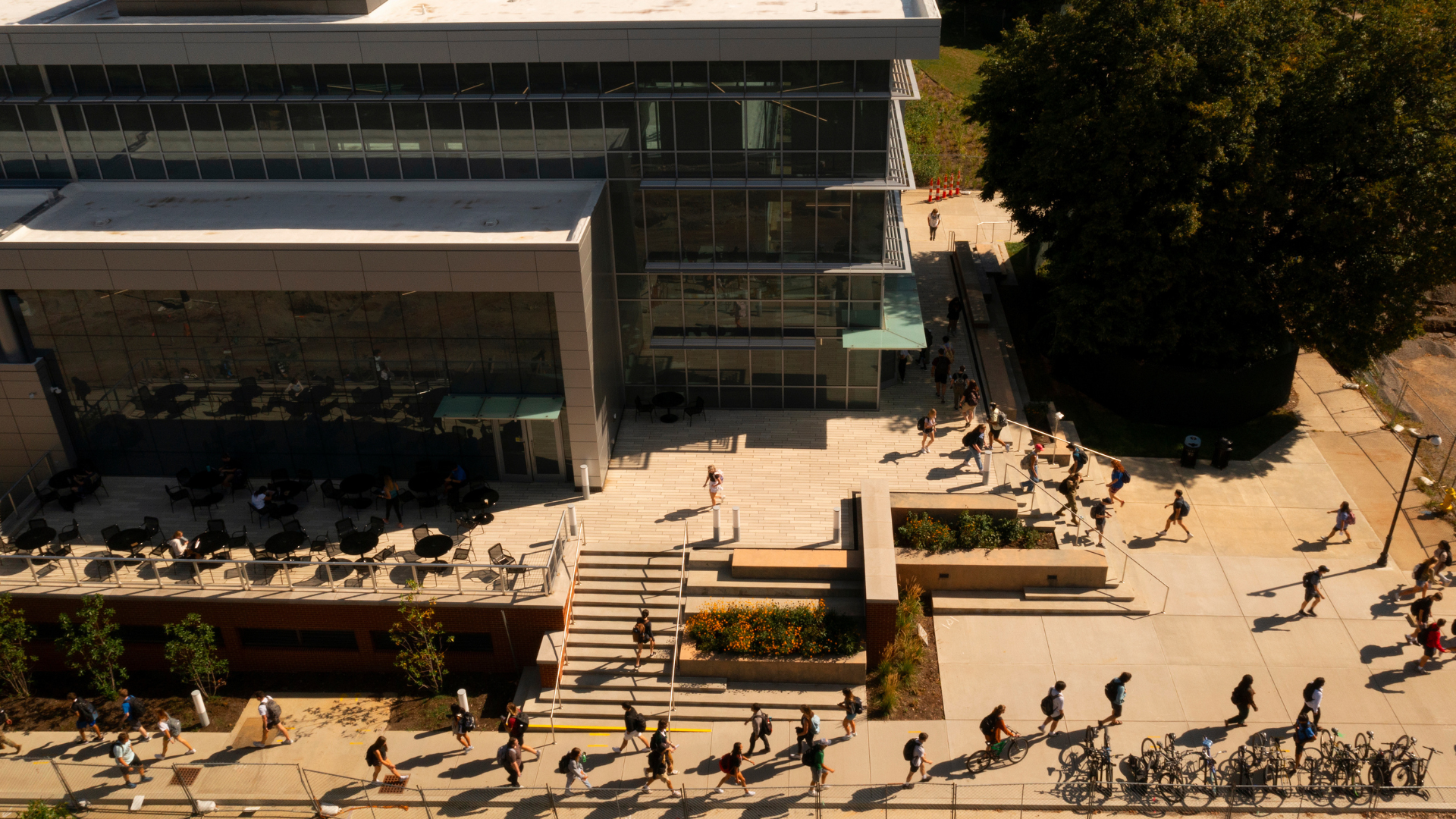 overhead photo of students walking beside the Chemistry-Physics building on campus