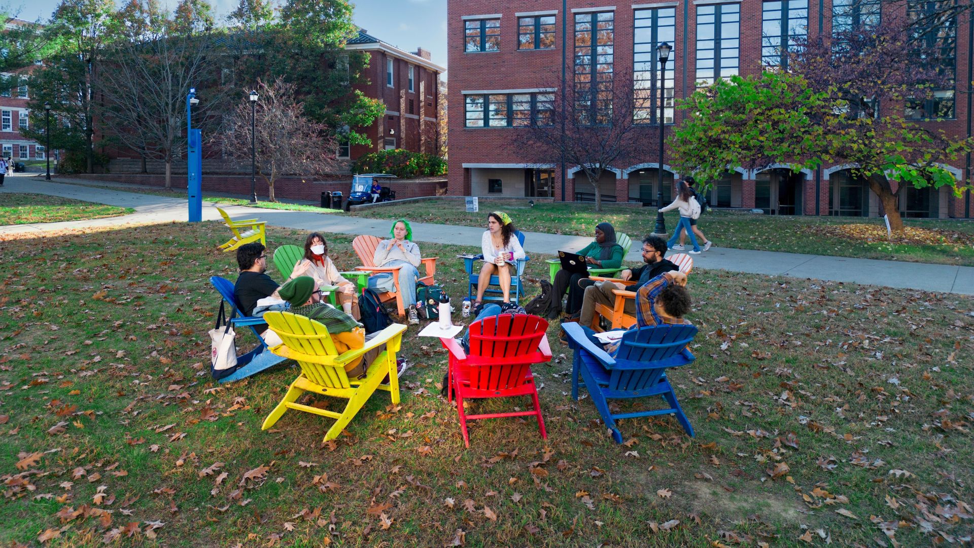 students sitting in a circle outside