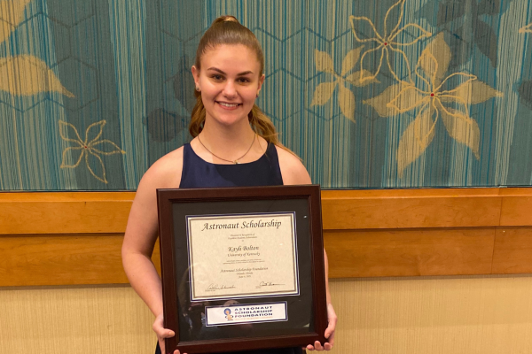 Kayli Bolton holding Astronaut Scholarship certificate