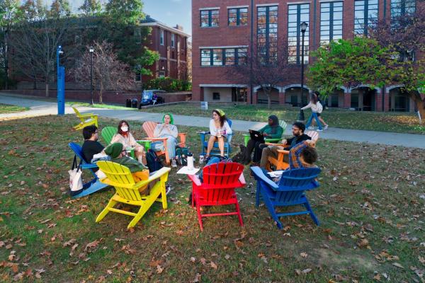 students sitting in a circle outside