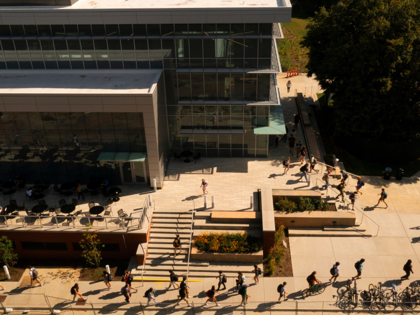 overhead photo of students walking beside the Chemistry-Physics building on campus