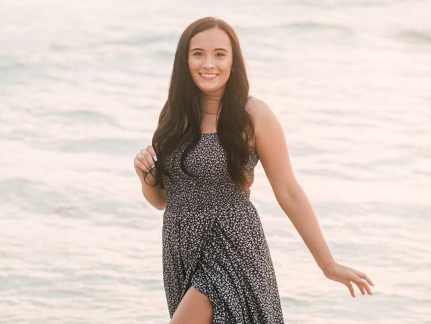 Sarah Bolton standing in front of the ocean