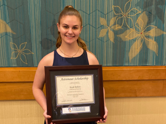 Kayli Bolton holding Astronaut Scholarship certificate