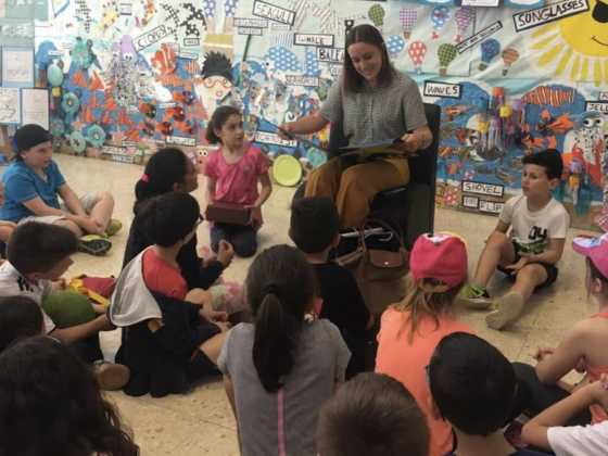 Calli Brooks reading to group of children
