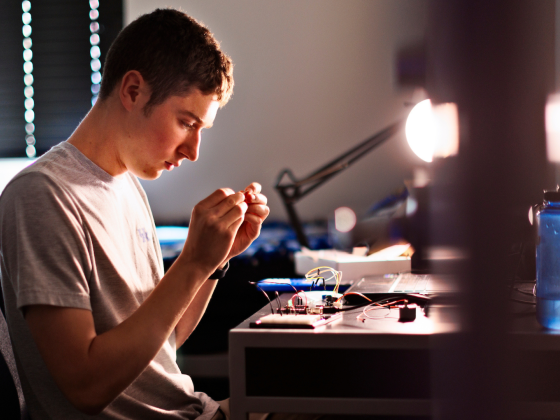 student at desk working on project