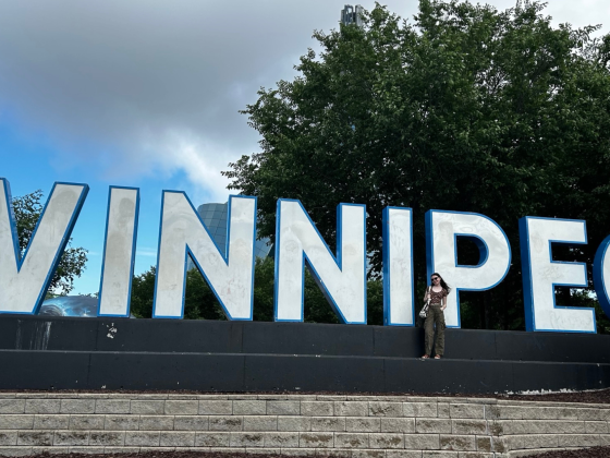 photo of Ella Brown-Terry in front of "Winnipeg" sign