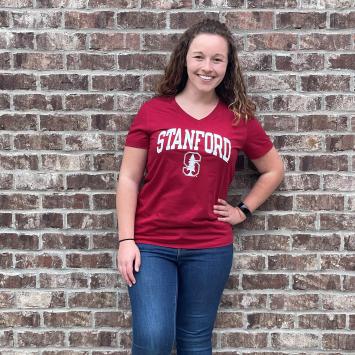 Shelby Buckman in front of brick wall