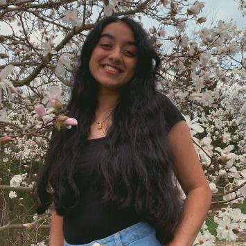 Isha Chauhan in front of tree