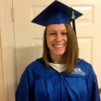 Caitlin Wetsch in graduation cap and gown