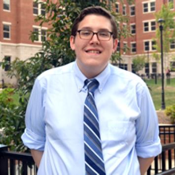 Daniel Dopp in front of residence hall