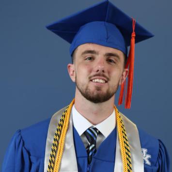 Dillon Pulliam in commencement cap and gown