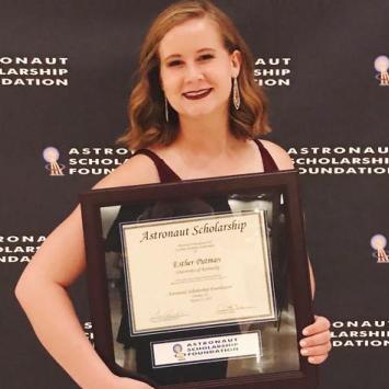 Esther Putman holding Astronaut Scholarship certificate