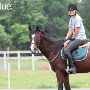 Madison Scott on horse with see blue logo in corner