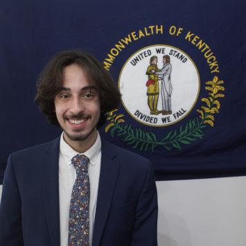 Sam Gianino in front of Kentucky state flag