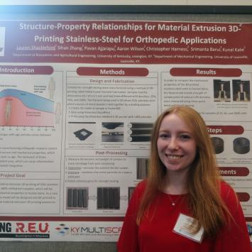 Lauren Shackleford in front of research poster